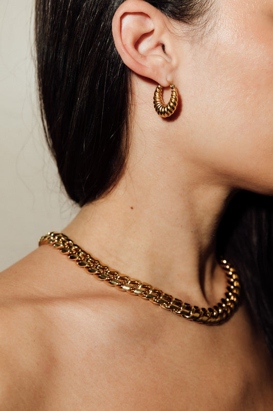 Anisa Sojka Gold Croissant Twisted Hoop Earrings